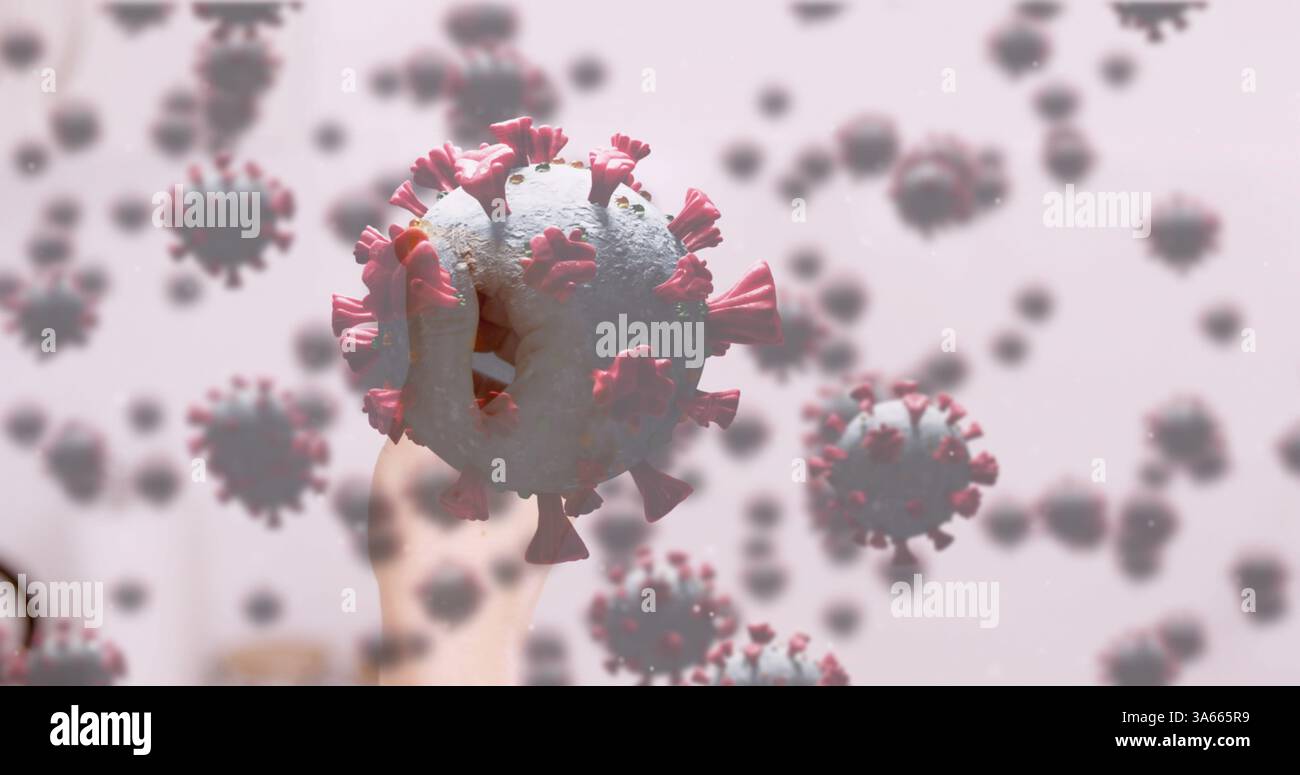 Main tenant un modèle 3D de coronavirus, mettant en évidence la structure et les détails du virus Banque D'Images