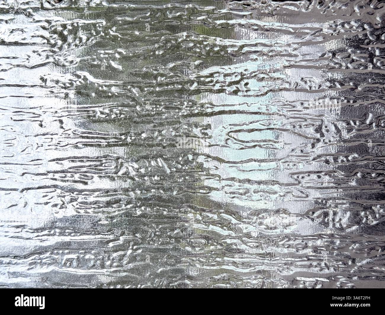 Gros plan du motif de verre de pluie texturé. Verre texturé 3D en motif pluie. Texture d'arrière-plan transparente Banque D'Images