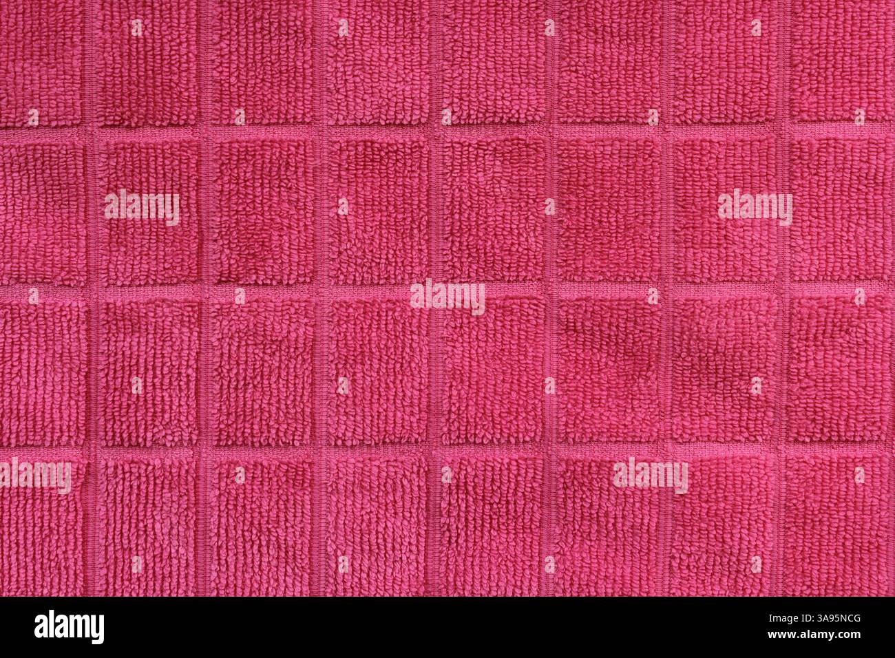 Gros plan texturé de tissu à motif carré rose Banque D'Images
