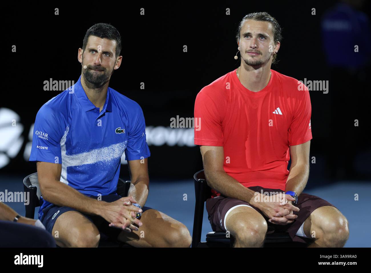 Alexander Zverev et Novak Djokovic lors d'une interview après match sur le terrain après leur match de charité, Australian Open 2025 Melbourne Park, Melbourne Banque D'Images