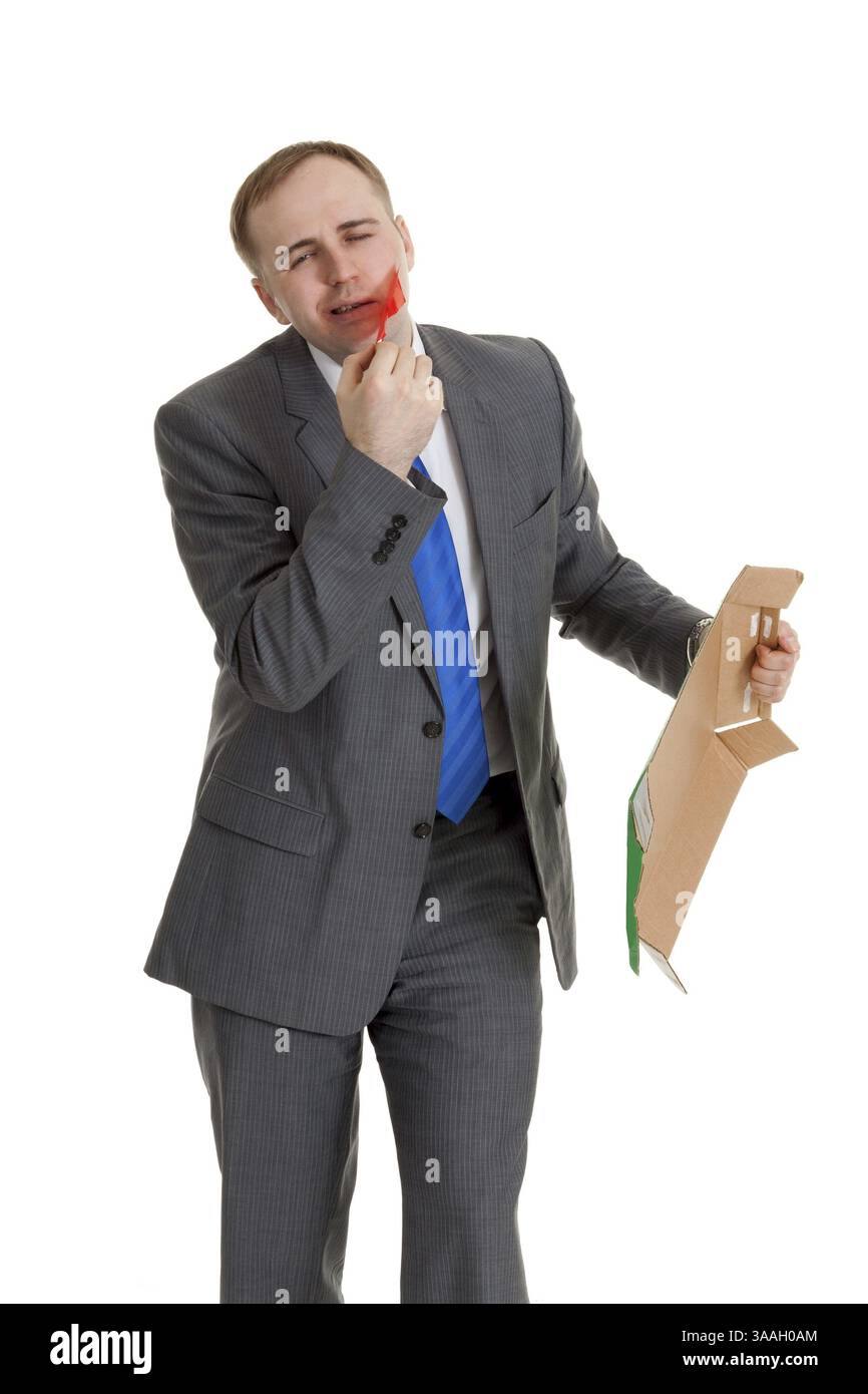 Homme d'affaires sépare la bureaucratie de sa bouche Banque D'Images