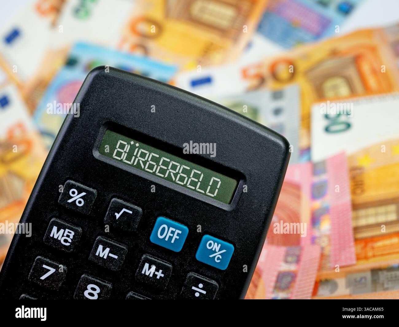 Calculatrice avec le mot "Revenu du citoyen" sur l'écran Banque D'Images