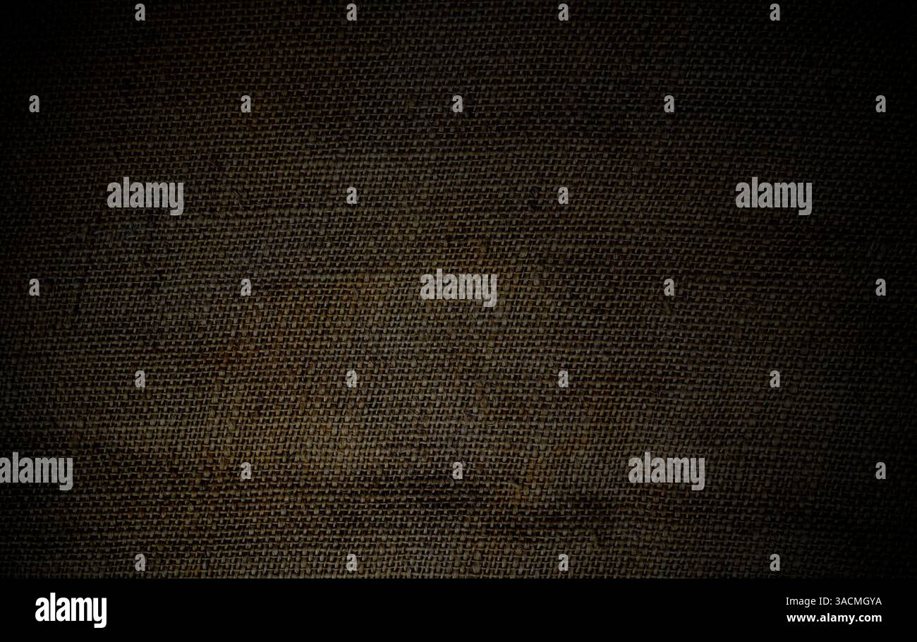 Texture de tissu brun foncé comme fond - toile de fond faite de sac de jute, sac de pomme de terre ou tissu de lin grossier Banque D'Images