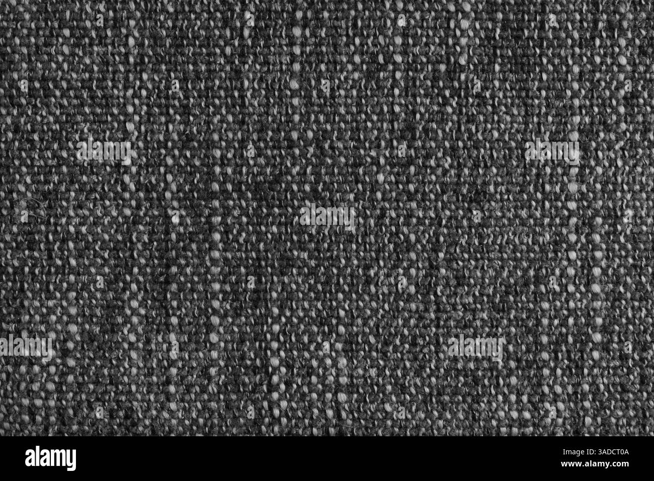 Tissu jacquard noir avec grand tissu d'ameublement à texture grossière tissé lâche. Fond textile, matériau textile de meubles, papier peint, backdr Banque D'Images