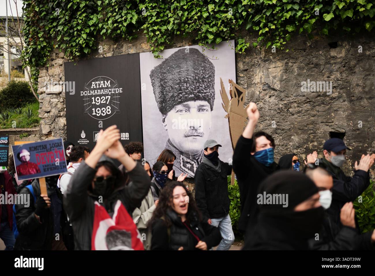 University students march past a photograph of Turkey's founder Mustafa ...