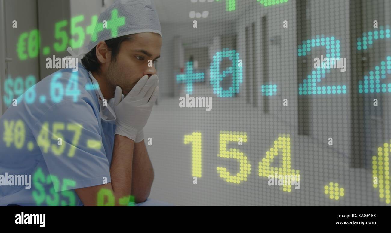 Traitement des données boursières contre un chirurgien stressé assis dans le couloir de l'hôpital Banque D'Images