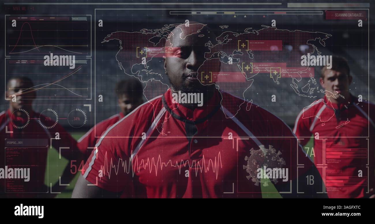 Joueurs de football en maillots rouges debout sur le terrain avec superposition de données numériques Banque D'Images