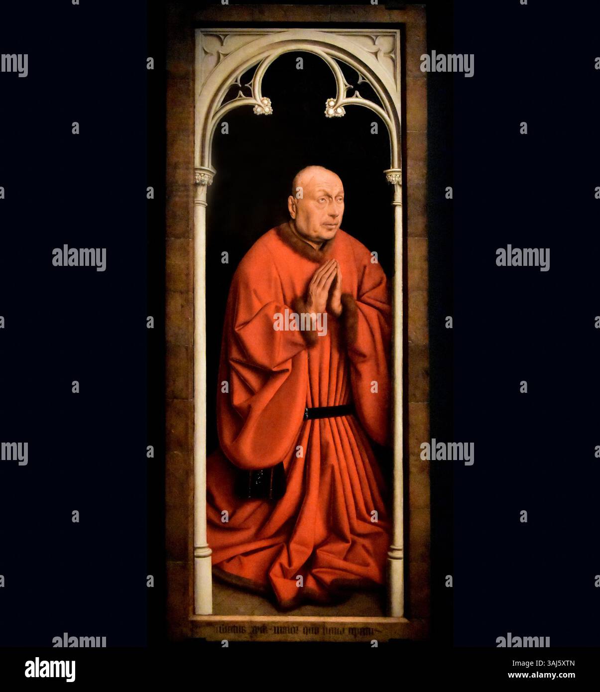 'Buitenluik met Joos Vijd' de Jan van Eyck, créé en 1432, représente l'Adoration de l'Agneau de Dieu. Ce chef-d'œuvre fait partie du célèbre retable de Gand. Banque D'Images