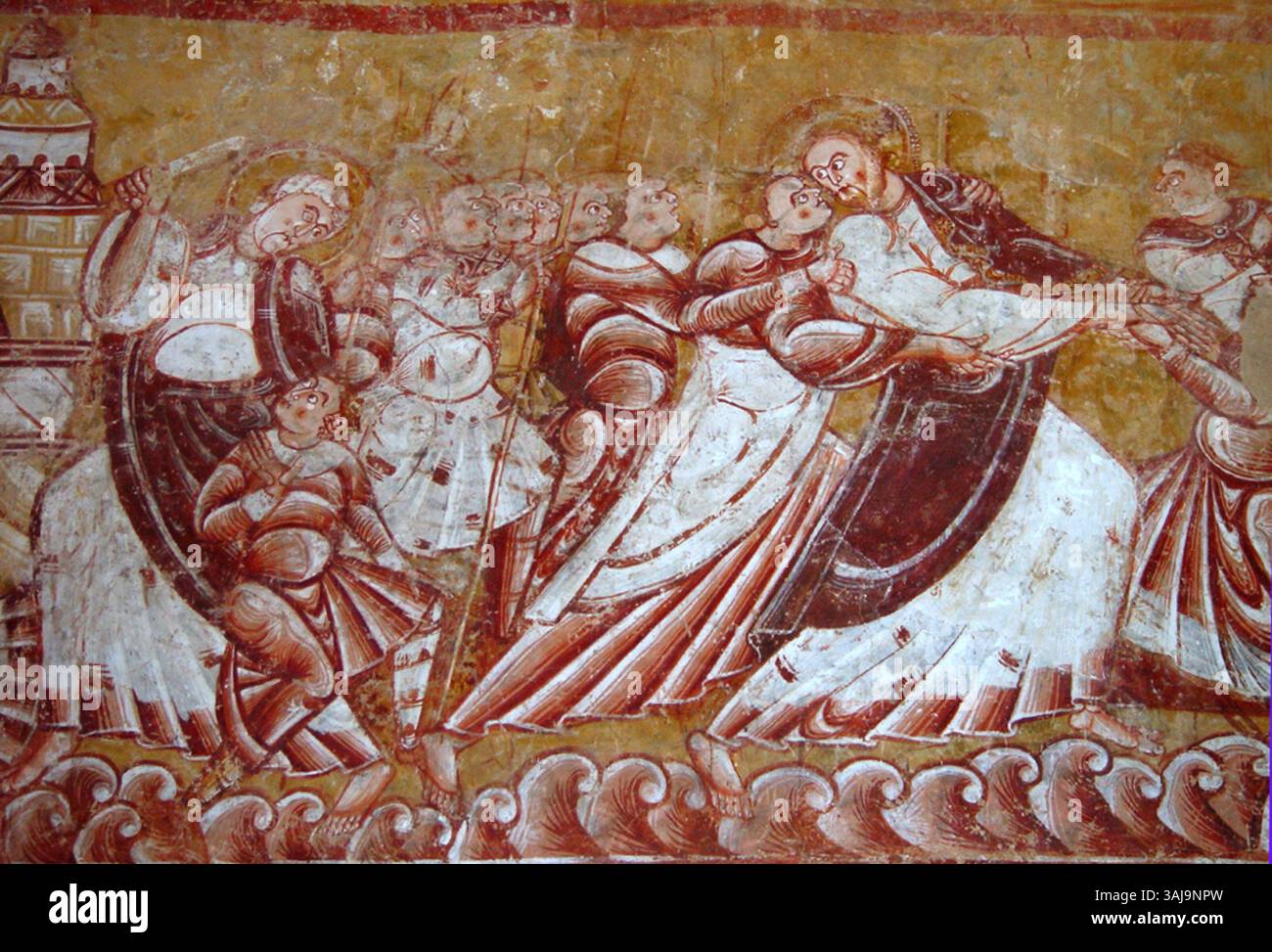 Cette fresque, créée entre 1135 et 1140, représente la trahison et l’arrestation du Christ, un événement pivot dans le récit de la passion, symbolisant les thèmes de la trahison et du sacrifice divin. Banque D'Images