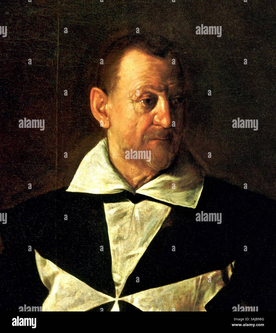 Le portrait de Fra Antonio Martelli réalisé par le Caravage en 1610 capture le frère franciscain avec un éclairage dramatique et un réalisme intense, caractéristiques du style du Caravage à l'époque baroque. Banque D'Images