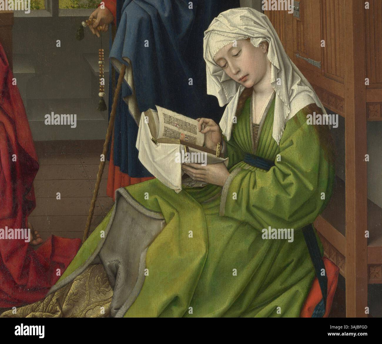 Cette version de « la lecture de la Madeleine » de Rogier van der Weyden représente Marie-Madeleine dans un moment de lecture, mettant en valeur l’utilisation par l’artiste de couleurs riches et l’attention portée au symbolisme religieux dans sa peinture à l’huile sur acajou. Banque D'Images