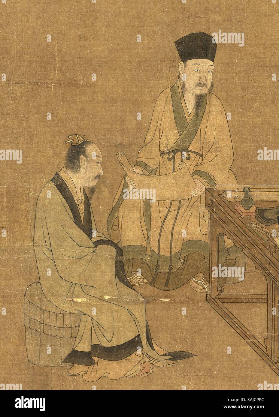 Cette peinture de Liu Songnian, intitulée "moudre le thé", montre deux hommes dans des robes traditionnelles daopao, engagés dans l'activité de moudre le thé. L'œuvre est un exemple de l'art de la dynastie des Song du Sud, reflétant la vie quotidienne pendant cette période. Banque D'Images