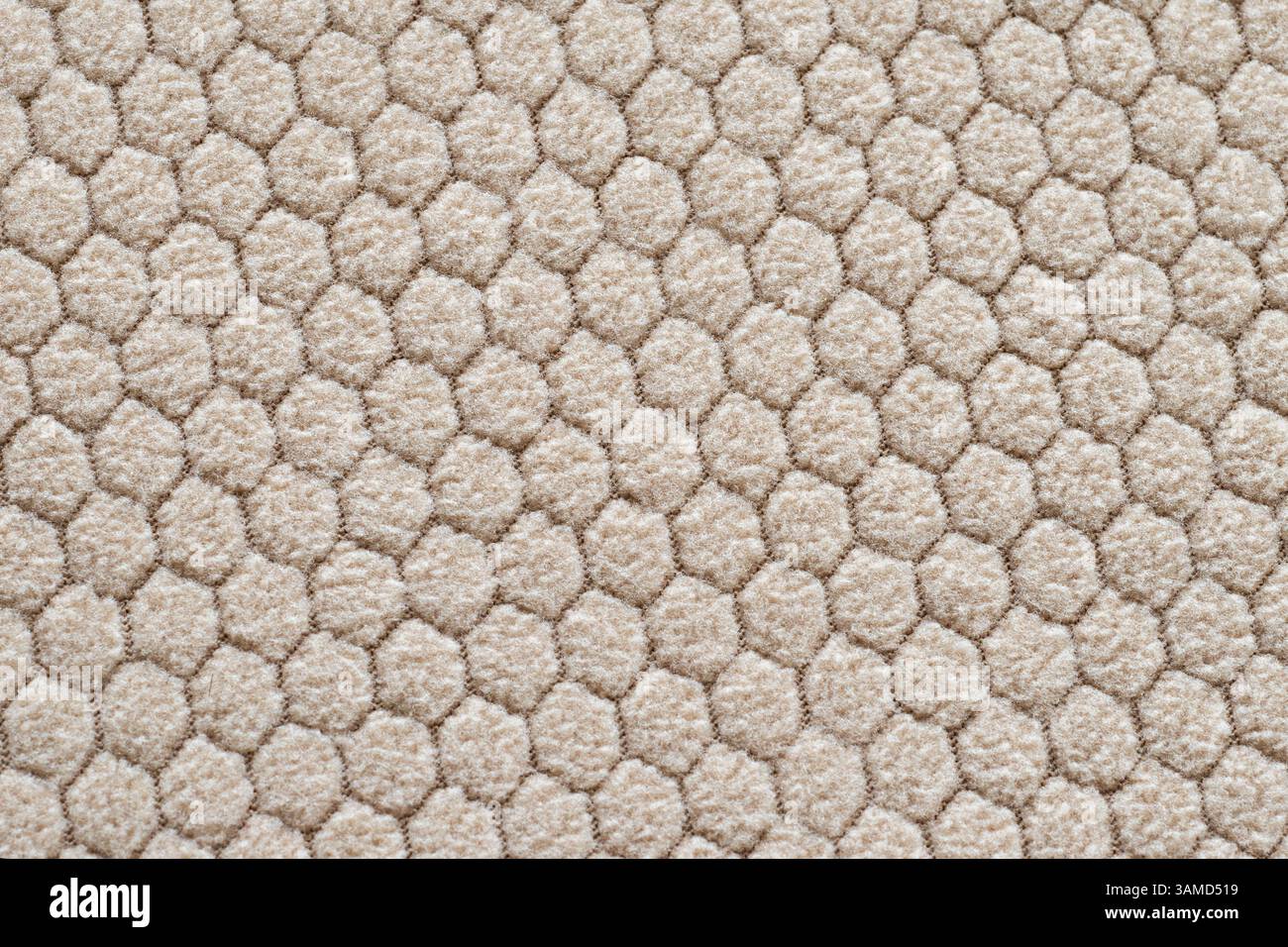 Motif moderne en nid d'abeille en couleur beige pour l'industrie textile Banque D'Images