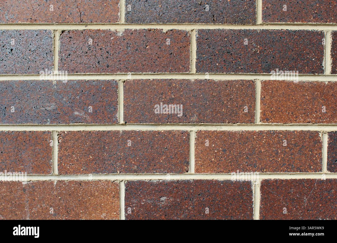 Fond texturé abstrait de mur de briques marron Banque D'Images