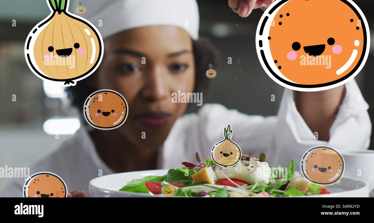 Image des icônes de fruits et légumes sur le chef afro-américain préparant un plat Banque D'Images