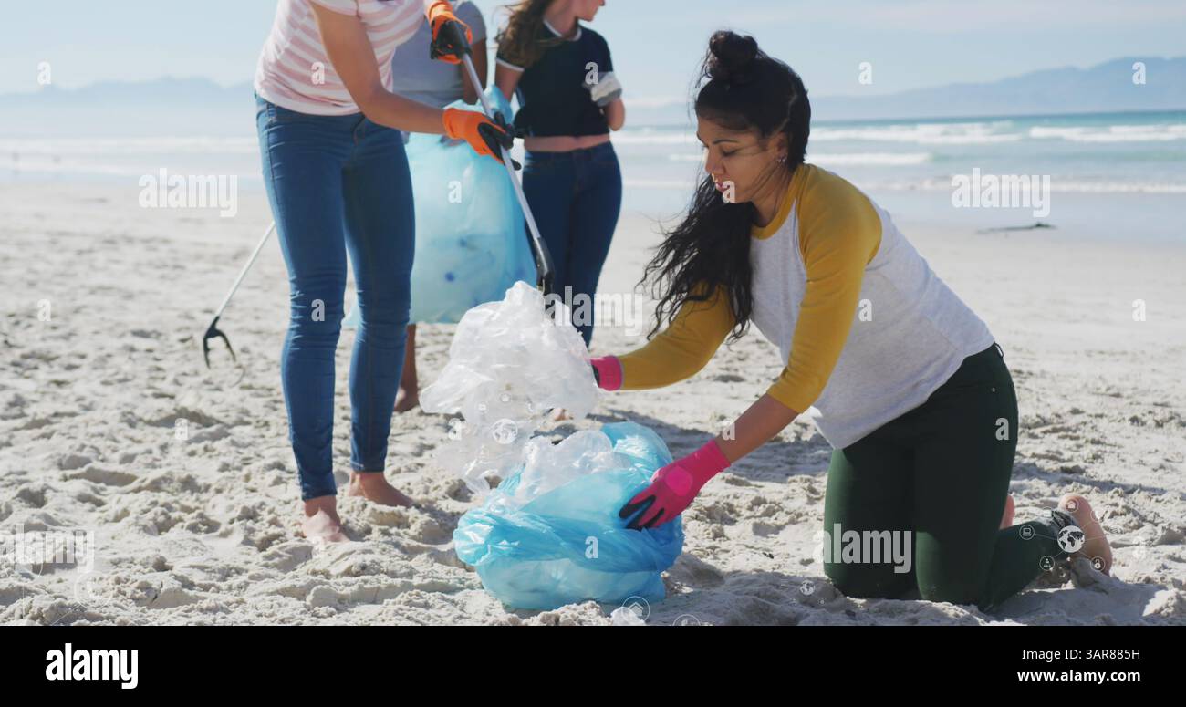 Image d'icônes de globe sur diverses volontaires féminines ramassant des ordures sur la plage Banque D'Images