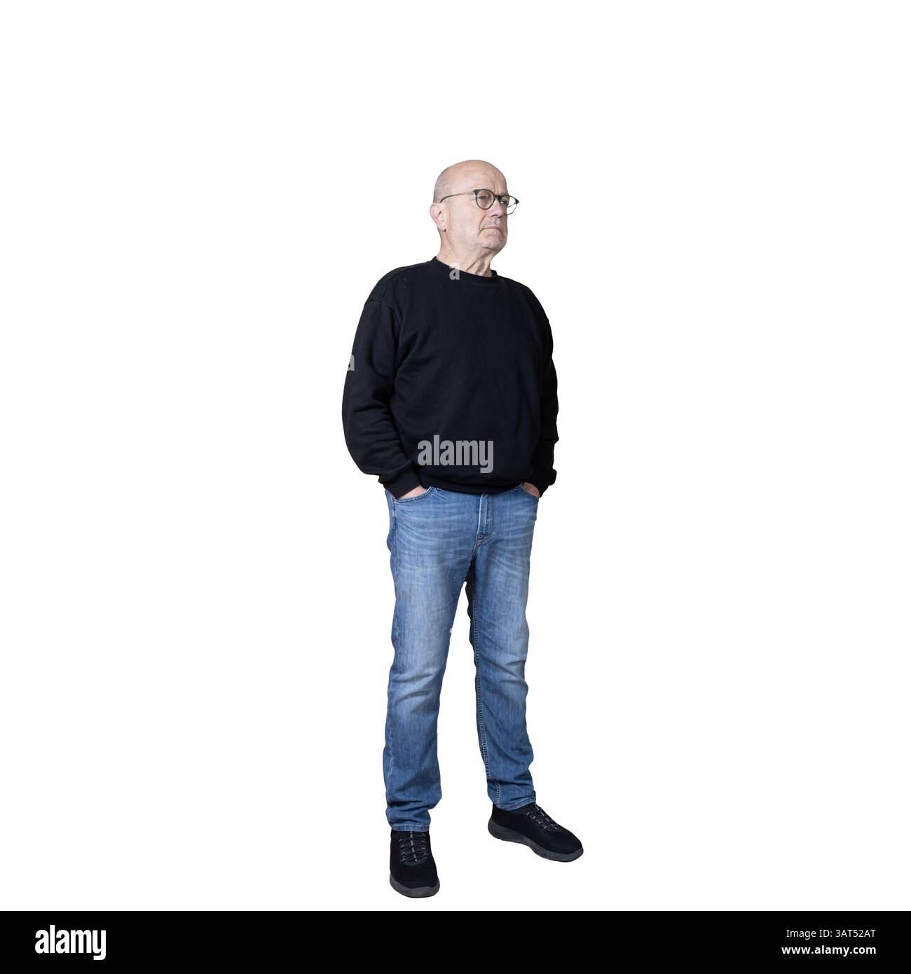 un homme les mains dans les poches tout en réfléchissant Banque D'Images