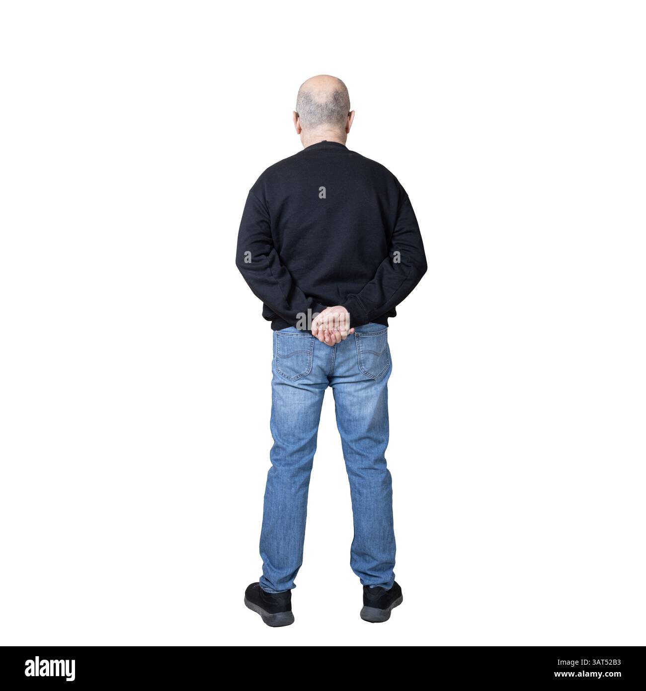 un homme avec ses bras derrière le dos en réfléchissant Banque D'Images