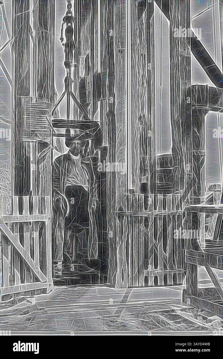 Une figure se tient dans une porte, encadrée par des poutres en bois et des machines industrielles. Le décor évoque un sentiment de nostalgie et des échos de travail, avec un jeu dramatique de lumière et d'ombre soulignant les contours de la scène., négatif - mineur en cage d'enroulement au sommet du puits de mine à la mine de Berringa, Berringa, Victoria, vers 1900, mineur en cage au sommet du puits de mine à la mine de Berringa. Le « code des signaux » de l'opérateur est cloué sur un poteau à côté de la cage., art classique avec une touche moderne réinventée par Artotop Banque D'Images
