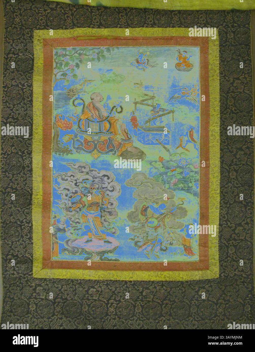Une tapisserie vibrante représentant une figure sereine assise sur un trône entourée de scènes complexes de paysages mythiques et d'êtres célestes, mettant en valeur des couleurs riches et un art détaillé. Bannière peinte (Thangka) d'un ensemble de sept honorant Gayadhara, un Pandit de l'Inde, 19ème siècle, Tibet, Tibet, pigment sur tissu, image : 43 x 29,5 cm, total : 109 x 62,6 cm Art classique avec une touche moderne réinventée par Artotop Banque D'Images