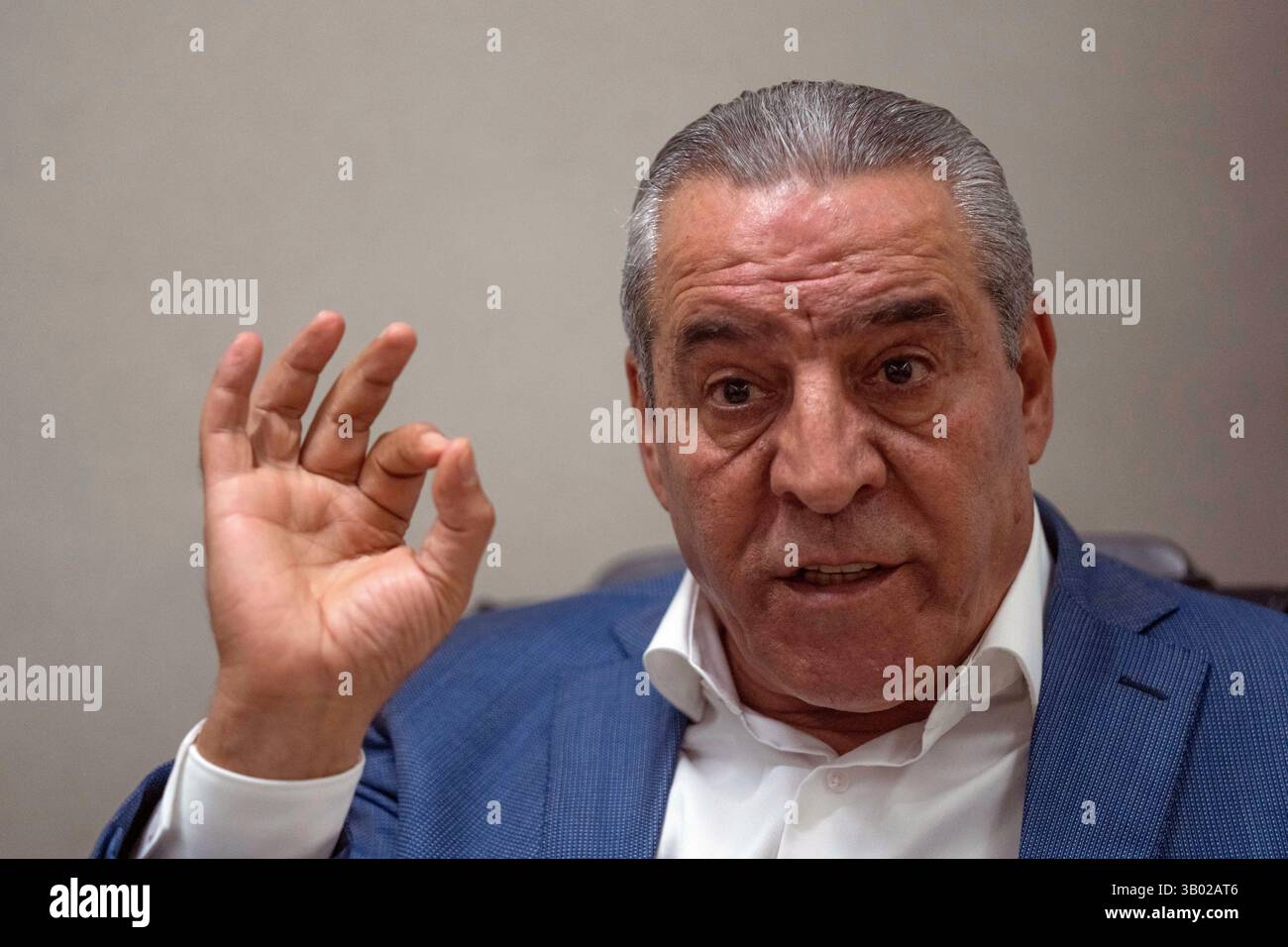 FILE - Hussein al-Sheikh, secretary-general of the Executive Committee of the Palestine Liberation Organization, gestures during an interview with The Associate Press at his office in the West Bank city of Ramallah, June 13, 2022. (AP Photo/Nasser Nasser, File) Banque D'Images