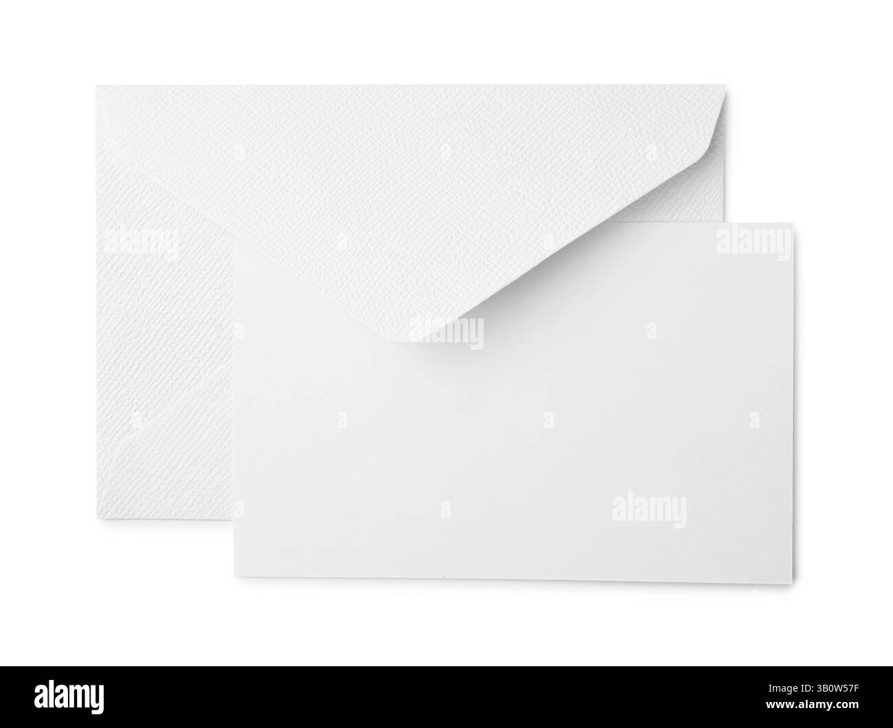 Carte de voeux vierge et enveloppe de papier sur fond blanc, vue de dessus Banque D'Images