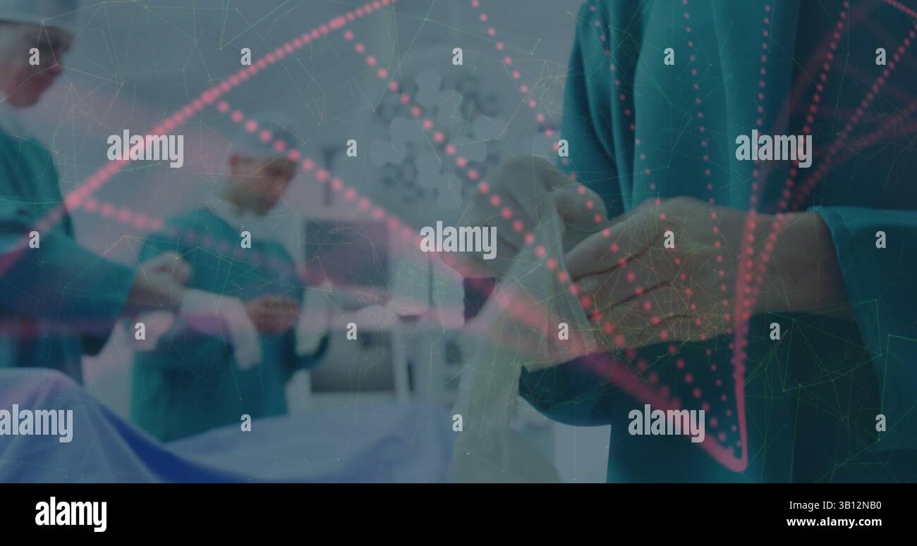 Frottez le membre du personnel en attachant des gants stériles dans la salle d'opération, avec un revêtement numérique et des lumières Banque D'Images