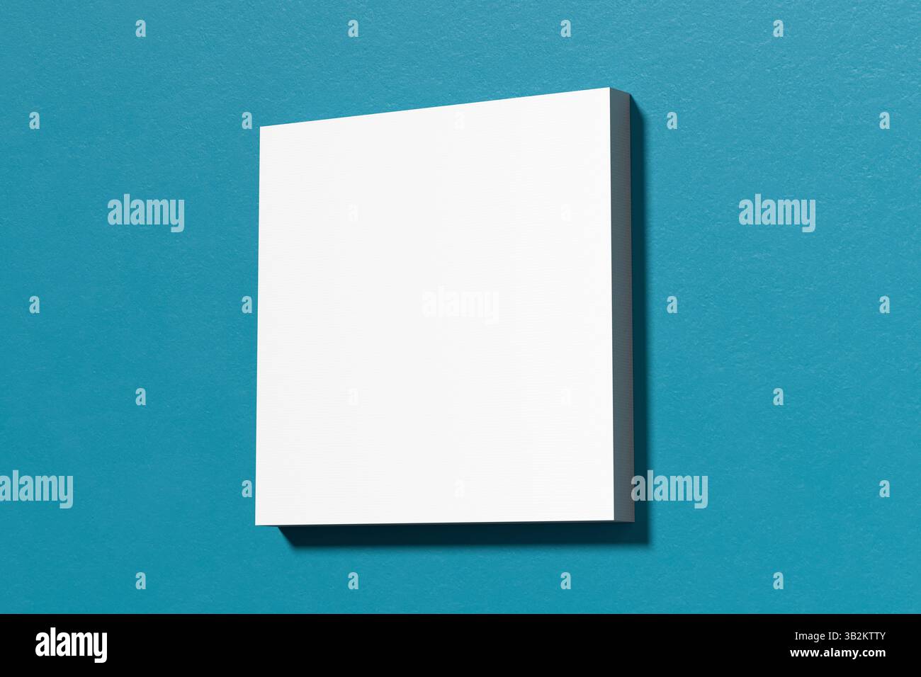 Composition minimaliste avec une toile carrée blanche vierge sur un mur bleu sarcelle éclatant, idéale pour mettre en valeur des œuvres d'art ou des dessins. Rendu 3D. Banque D'Images