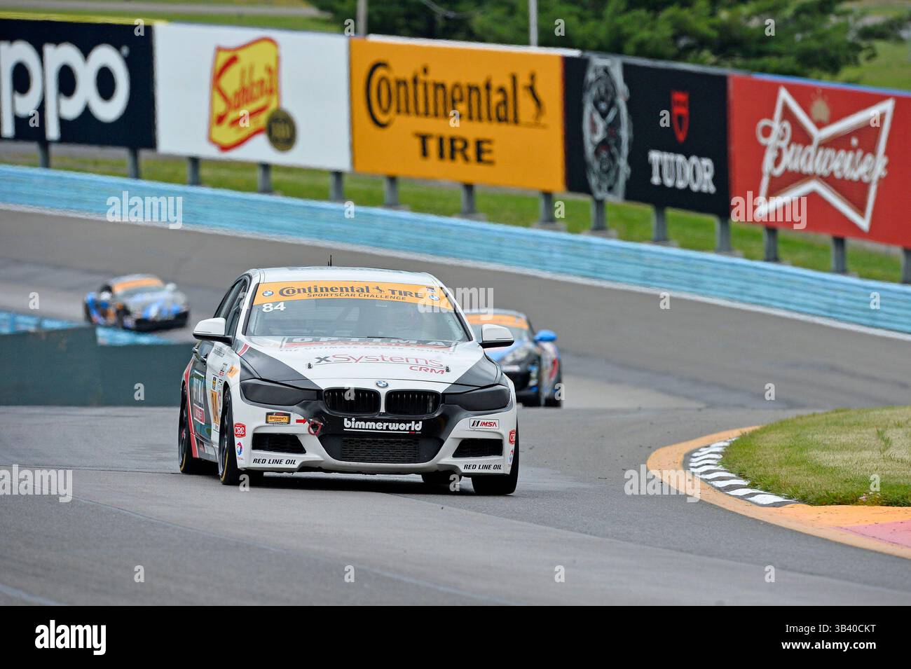 25 juin 2015 - Watkins Glen, NY, États-Unis - Watkins Glen, NY - 25 juin 2015 : la BimmerWorld Racing BMW 328i (#84) court dans les virages lors des essais au Continental Tire 150 au Glen au Watkins Glen International à Watkins Glen, NY.(image crédit : © ASP/Cal Sport Media/ZUMAPRESS.com) Banque D'Images