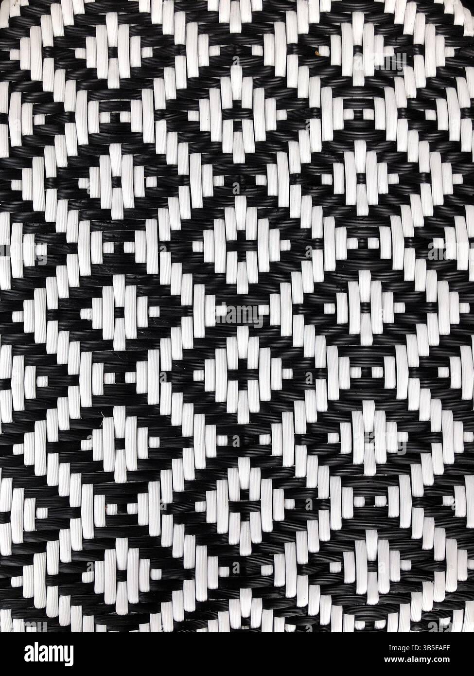 Gros plan de la texture de motif diamant tissé noir et blanc Banque D'Images