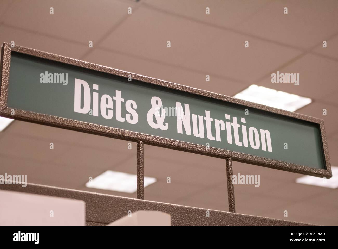 Une vue d'un signe de genre dans une librairie pour les régimes et la nutrition. Banque D'Images