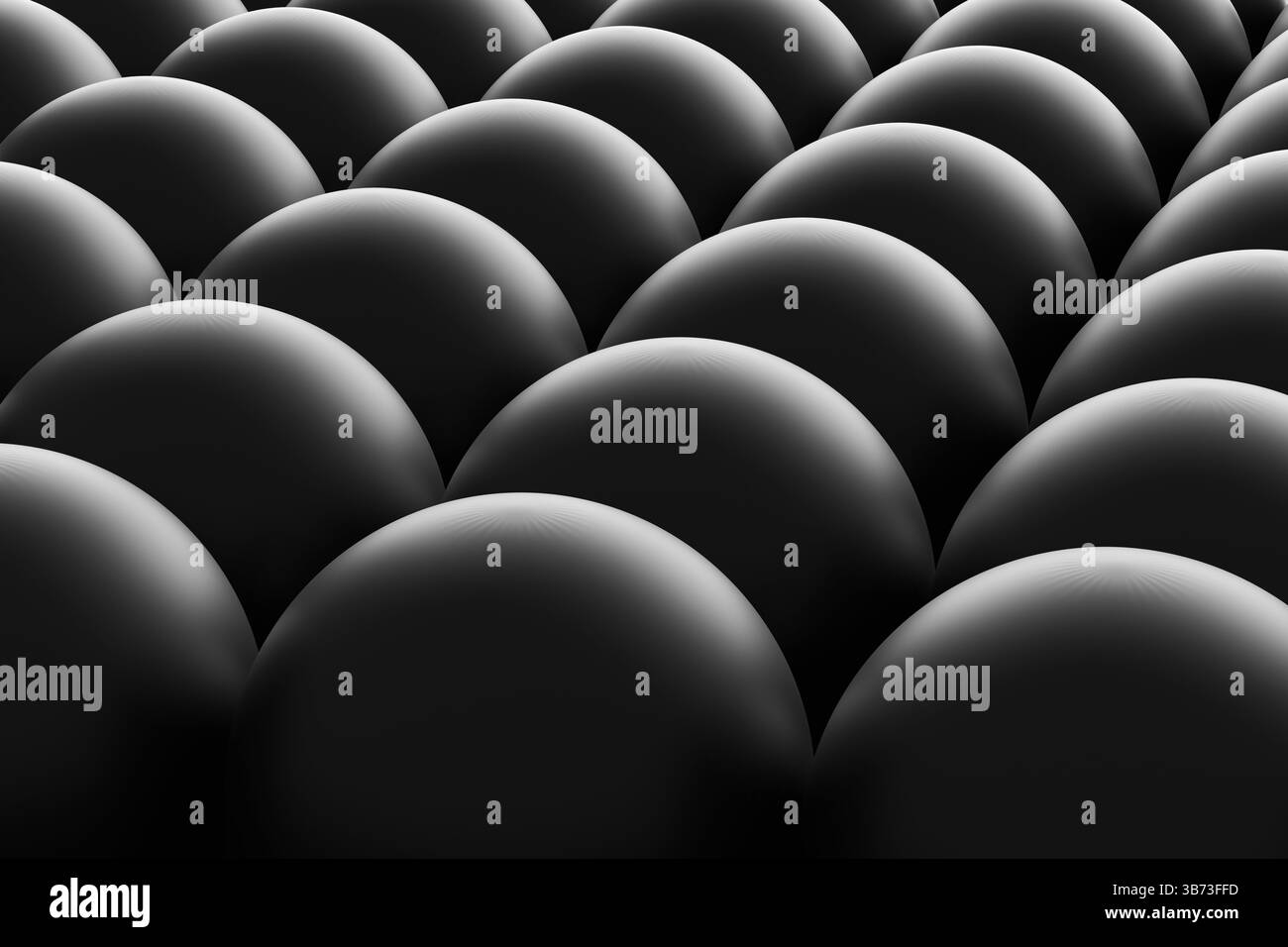 Fond abstrait noir avec des sphères sombres, formant un motif uniforme qui crée un effet textural fascinant Banque D'Images