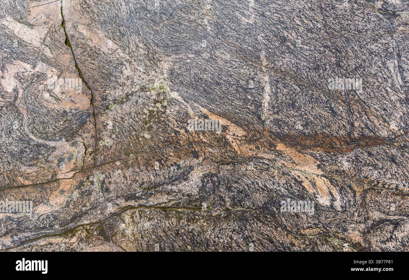 Texture détaillée d'une pierre altérée avec des fissures visibles. Banque D'Images