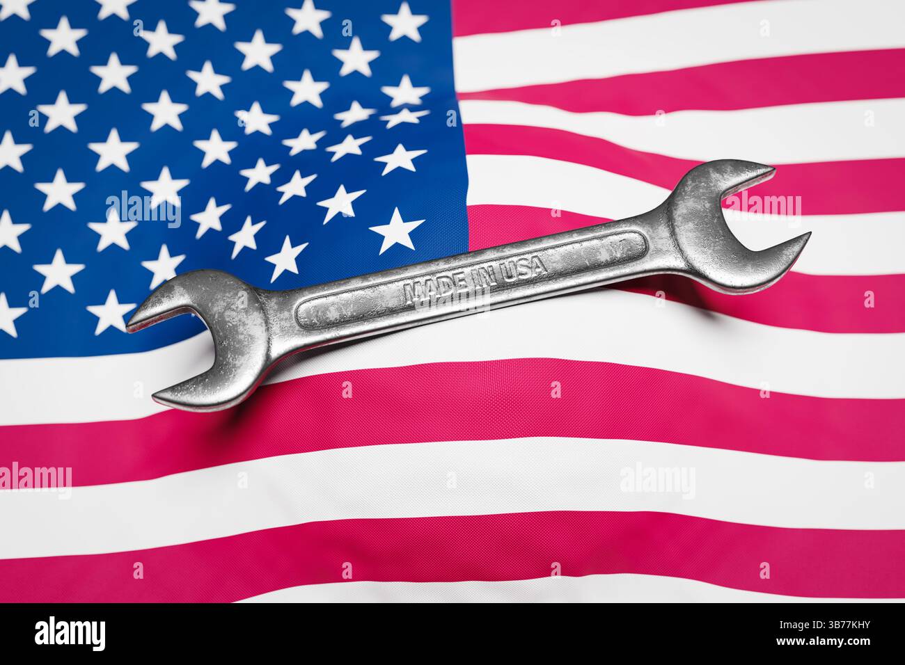 Une clé avec le texte « Made in USA » sur un drapeau américain. Concept pour les produits industriels fabriqués aux Etats-Unis. Banque D'Images