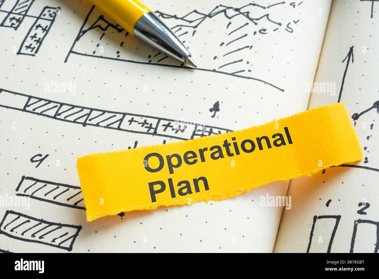 Bloc-notes de plan opérationnel avec graphiques. Concept de stratégie commerciale. Banque D'Images