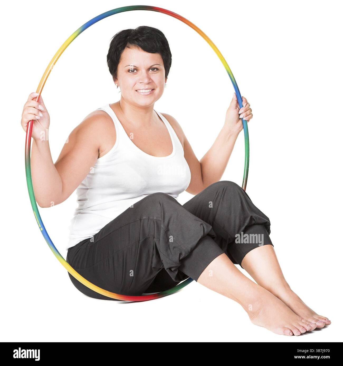 Grosse femme avec des cerceaux de hula Banque D'Images