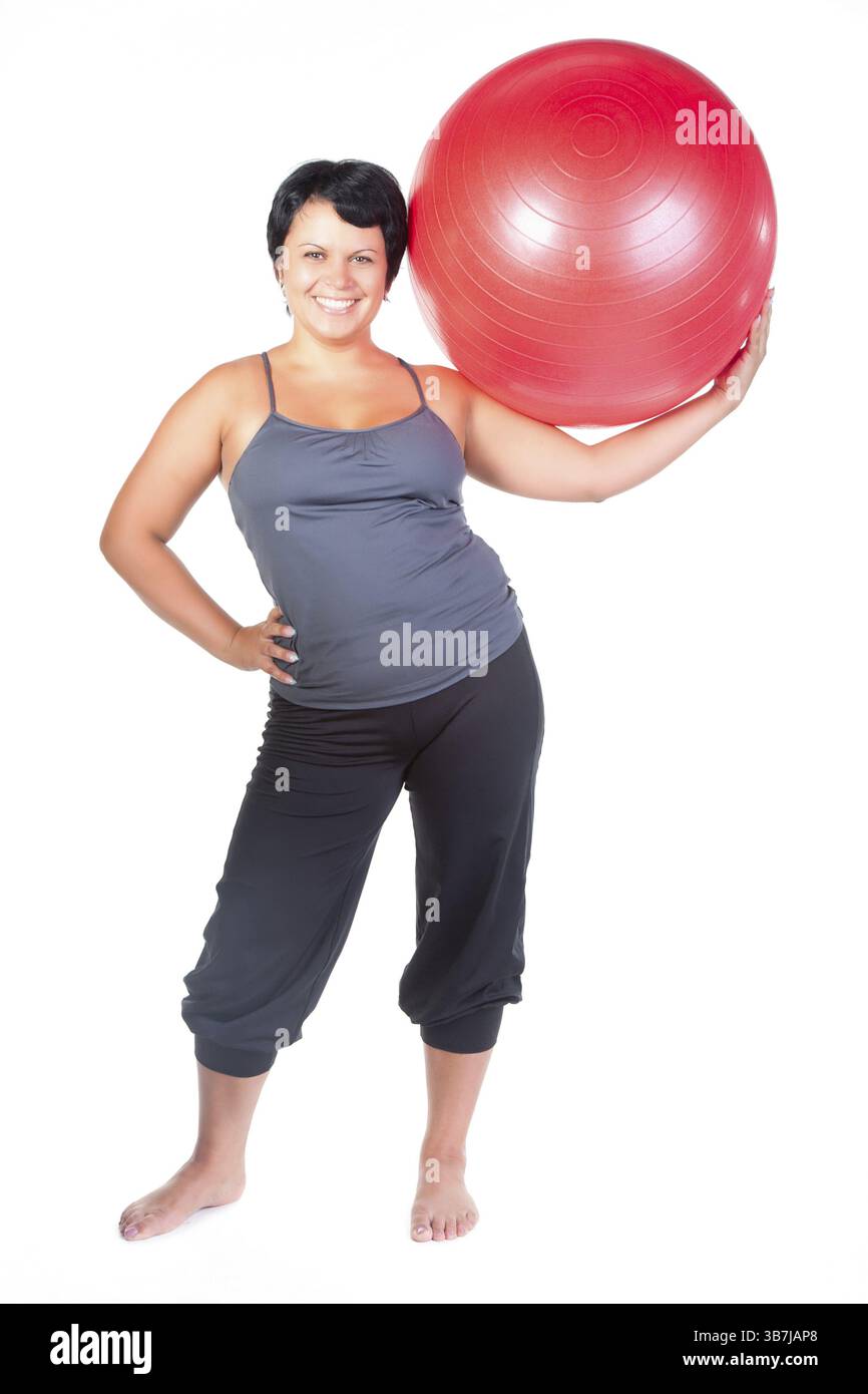 Grosse femme avec une grosse boule rouge Banque D'Images