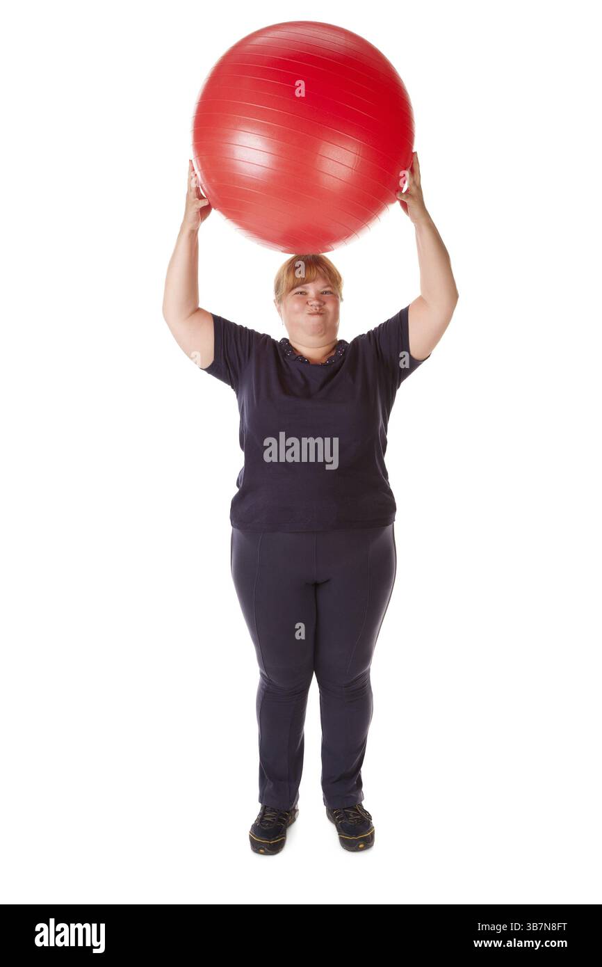 Grosse femme avec une grosse boule cardan rouge Banque D'Images