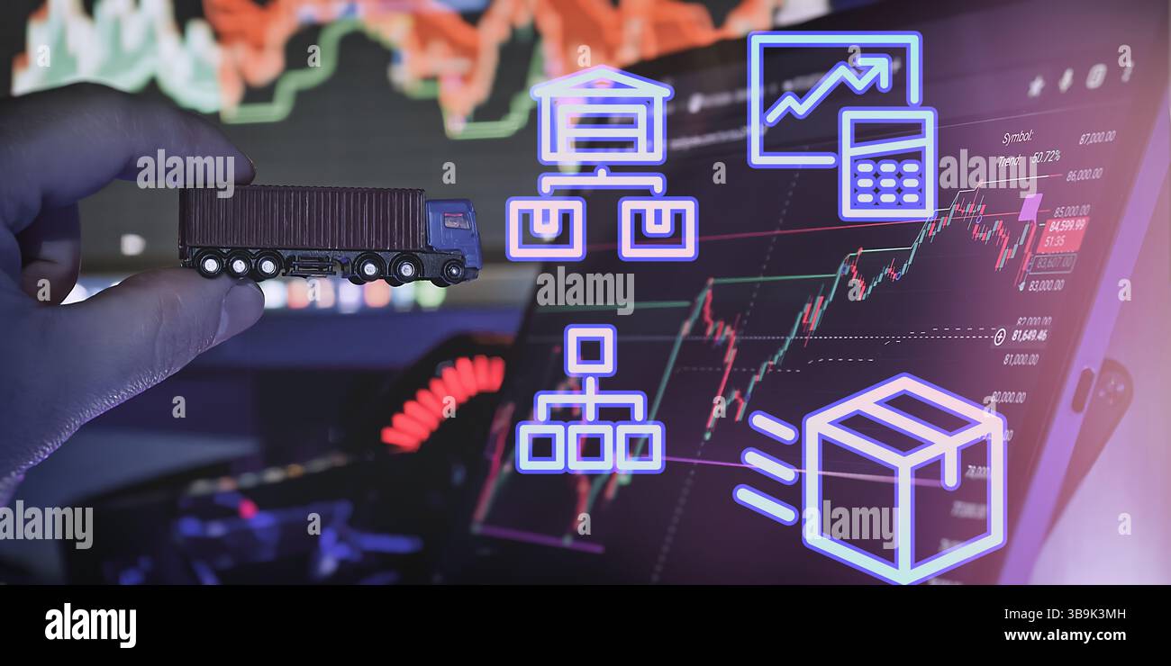 Main tenant un camion-jouet devant un écran numérique montrant les icônes de la chaîne d'approvisionnement, le flux logistique et les graphiques du marché financier. Banque D'Images