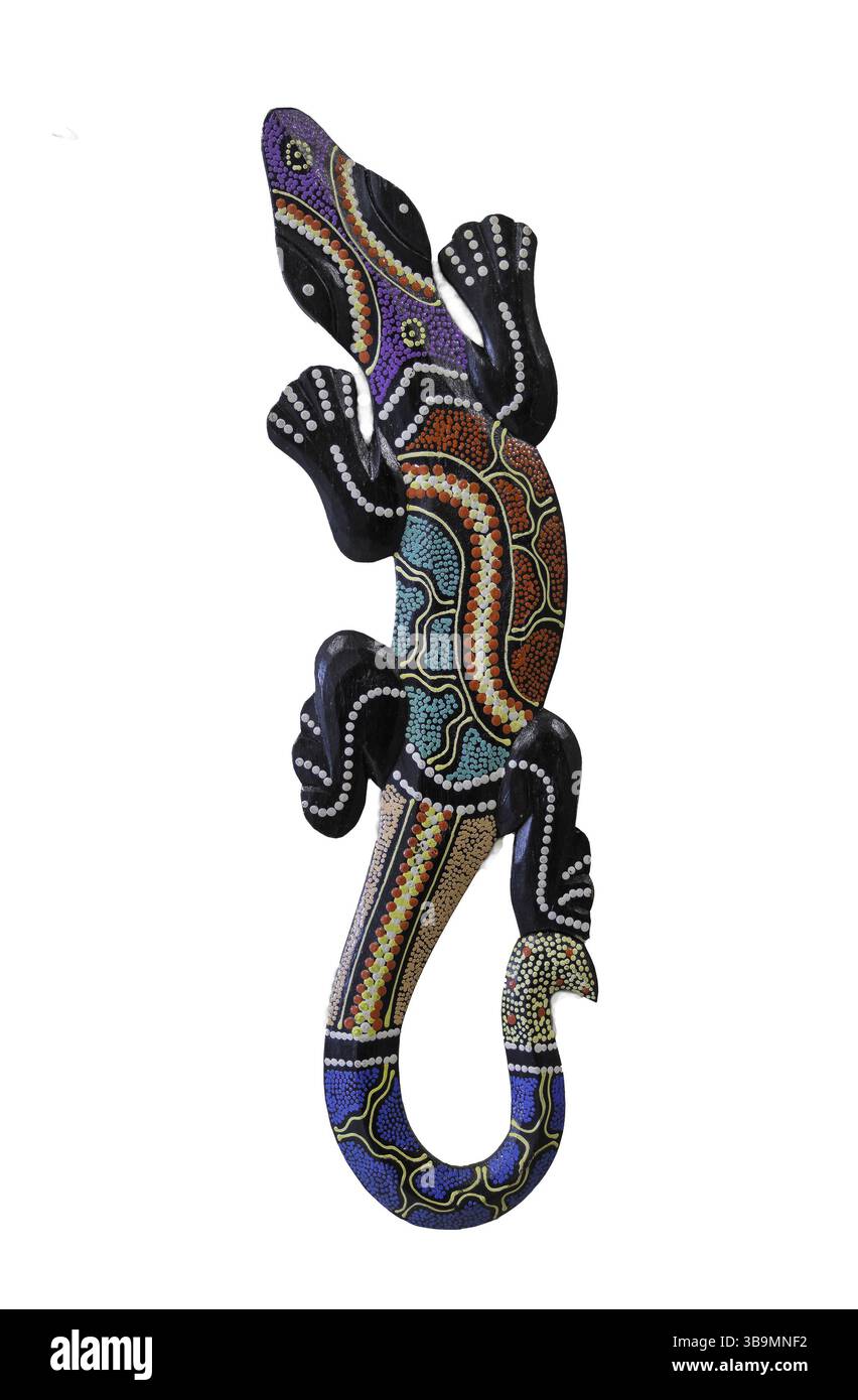 L'image représente une œuvre d'art aborigène dynamique et complexe mettant en vedette un lézard stylisé ou une créature ressemblant à un gecko. Banque D'Images