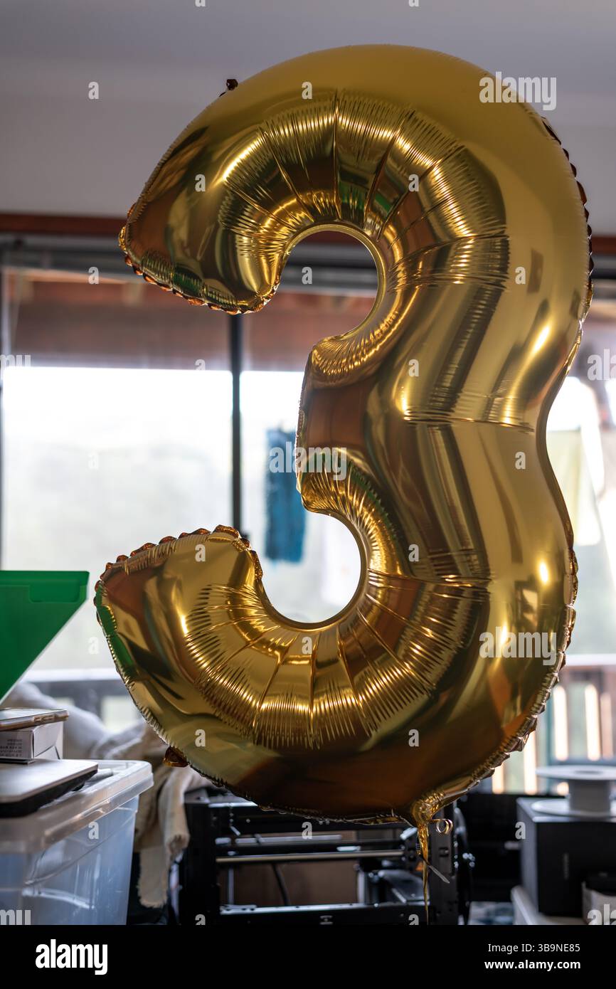 Ballon en feuille d'or numéro 3 Banque D'Images
