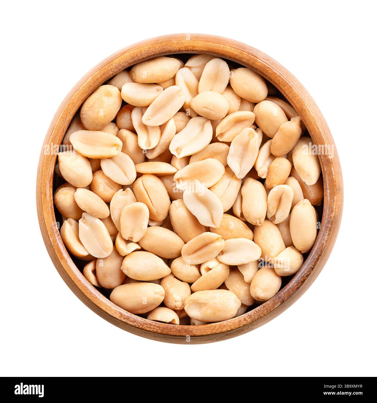 Cacahuètes rôties dans un bol en bois. Snack croquant prêt-à-manger, fabriqué à partir des fruits d'Arachis hypogaea, également connu sous le nom d'arachide, goober, etc Banque D'Images