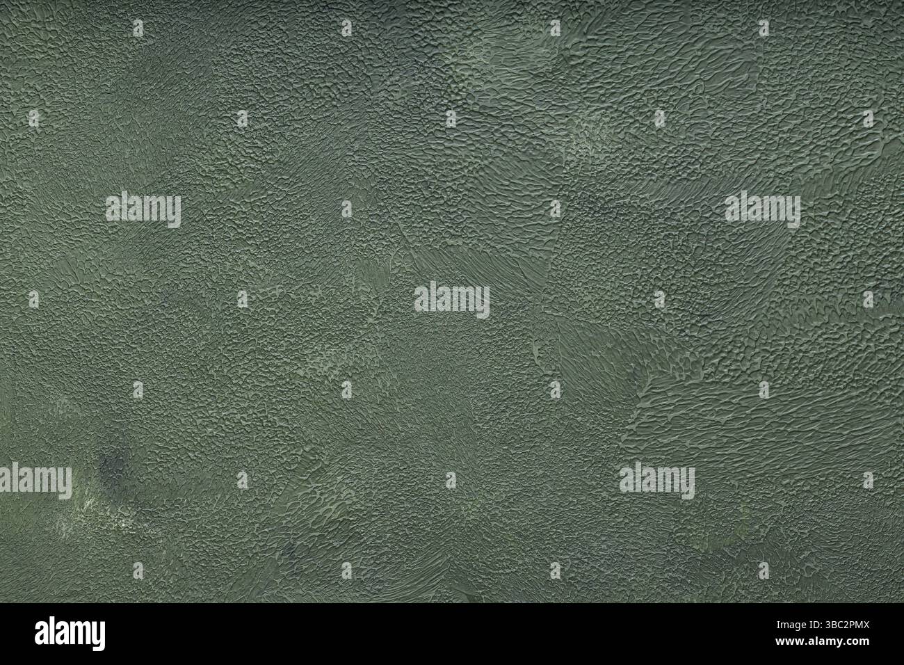 Fond texturé vert avec surface de mur de plâtre décoratif rugueux Banque D'Images