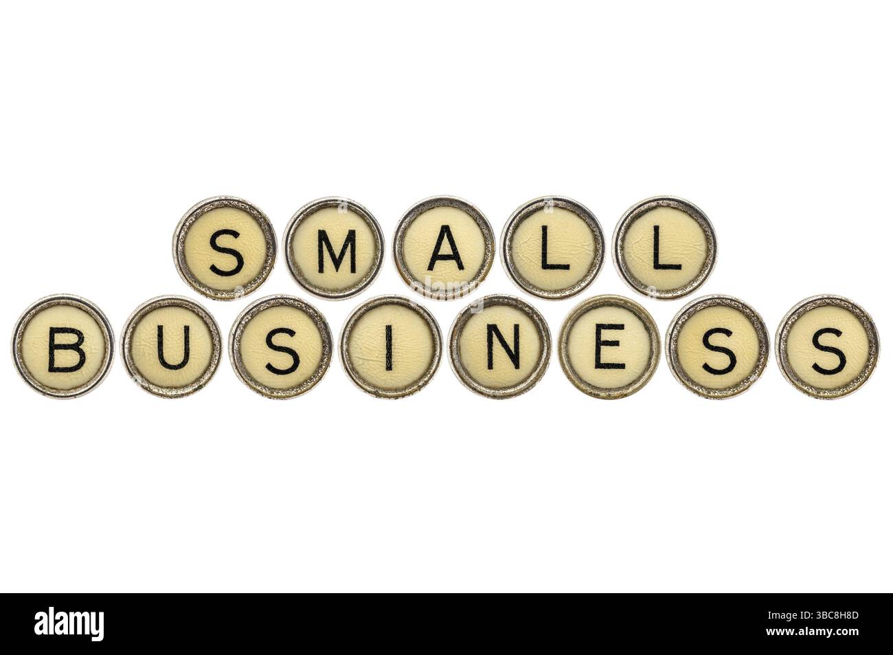 Texte de petite entreprise dans de vieilles clés rondes de machine à écrire isolé sur blanc Banque D'Images