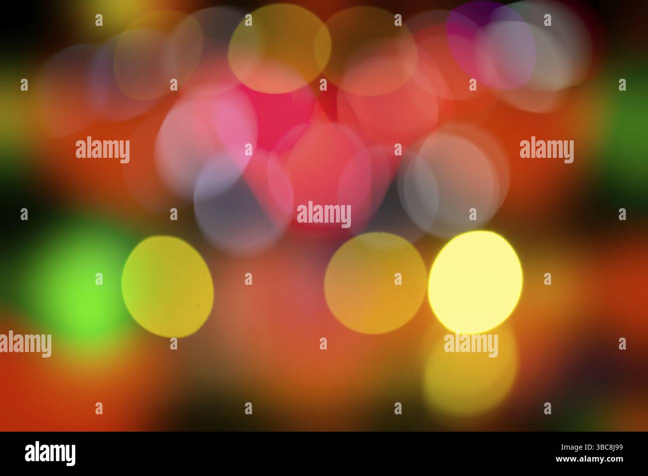 Joyeuses fêtes de bokeh colorées pour affiche de divertissement Banque D'Images