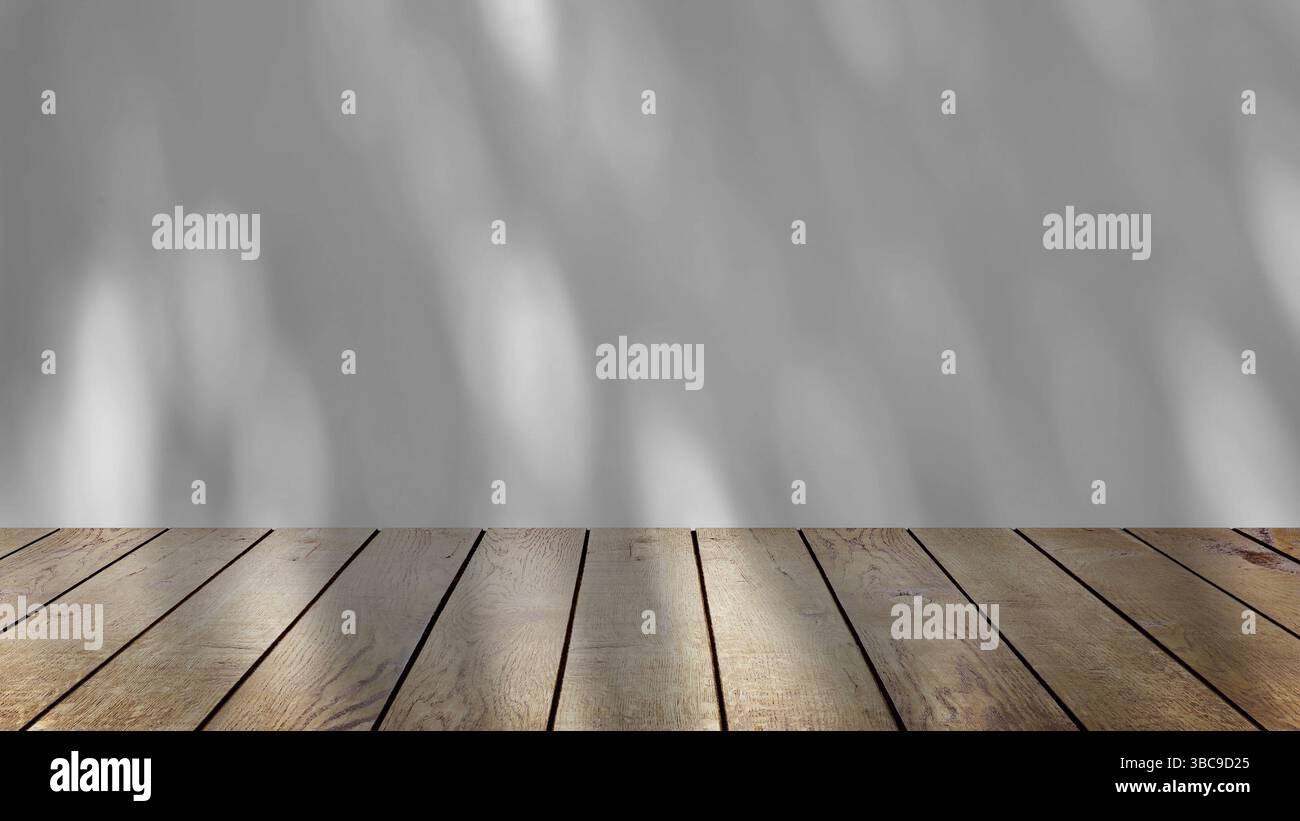 ombre des arbres se balançant doucement dans la brise, sur un fond blanc avec une table en bois. Banque D'Images