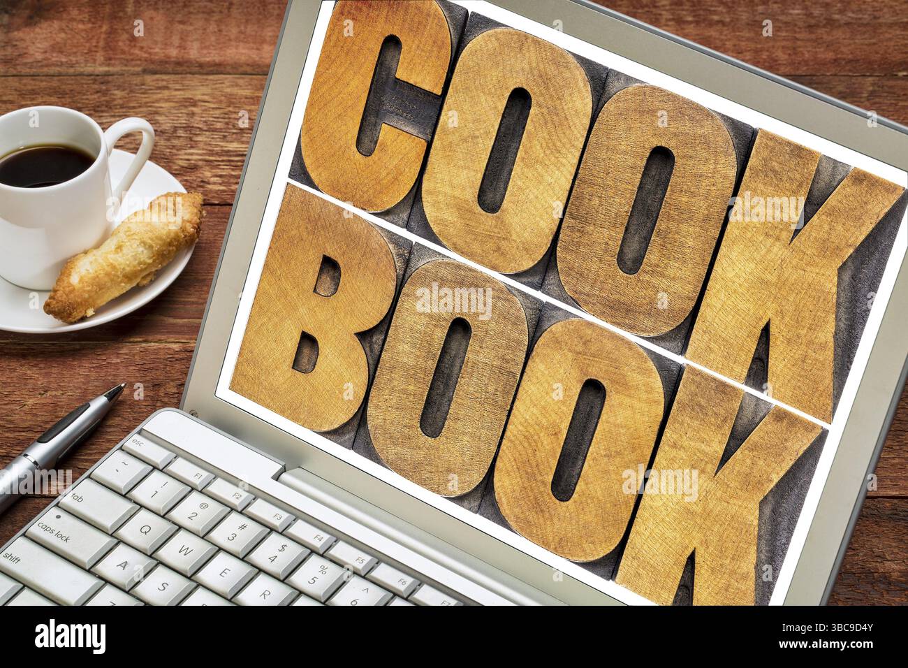 Résumé de mot de livre de cuisine - texte en type de bois typographique sur un écran d'ordinateur portable Banque D'Images