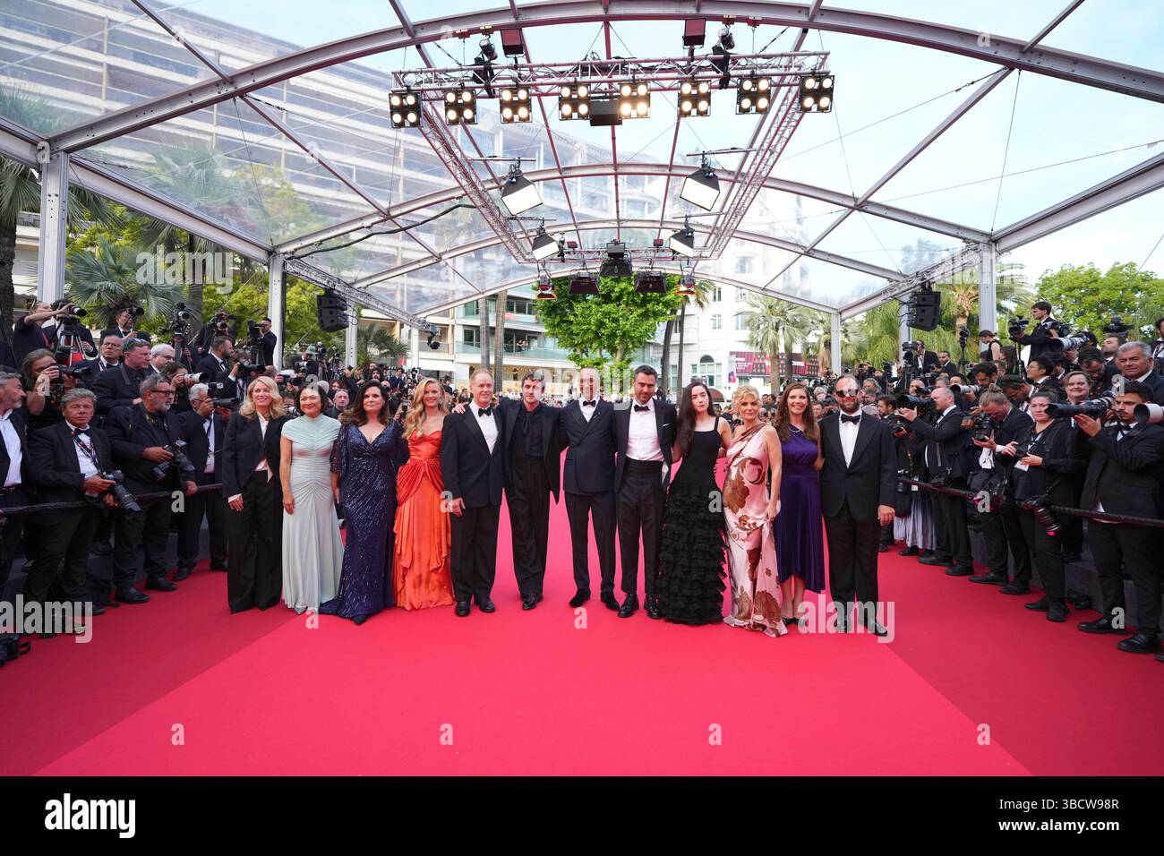 Producer Sara Murphy, from left, Zhang Xin, producer Theresa Ryan, Hadley Robinson, Raphael Sbarge, Paul Mescal, director Oliver Hermanus, writer Ben Shattuck, Emma Canning, Alison Bartlett, Lisa Ciuffetti and producer Andrew Kortschak pose for photographers upon arrival at the premiere of the film 'The History of Sound' at the 78th international film festival, Cannes, southern France, Wednesday, May 21, 2025. (AP Photo/Natacha Pisarenko) Banque D'Images