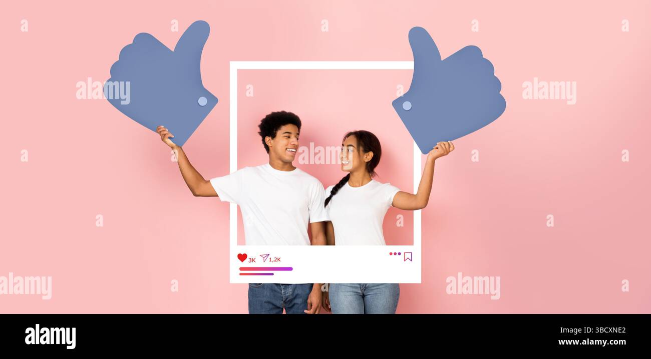 Engager les influenceurs des médias sociaux partageant des pouces vers le haut pour du contenu positif Banque D'Images