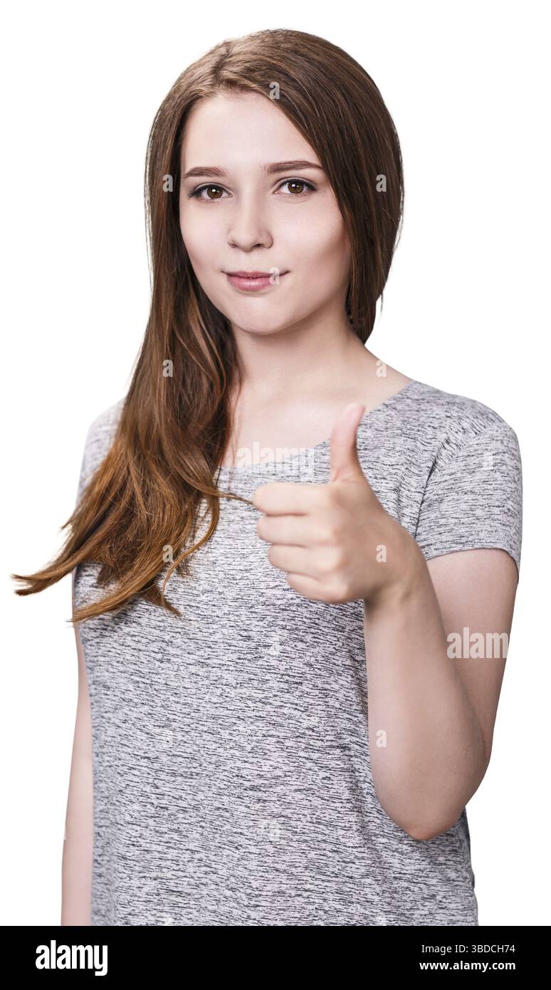 Jeune fille montrant un geste pouces vers le haut sur le fond blanc Banque D'Images